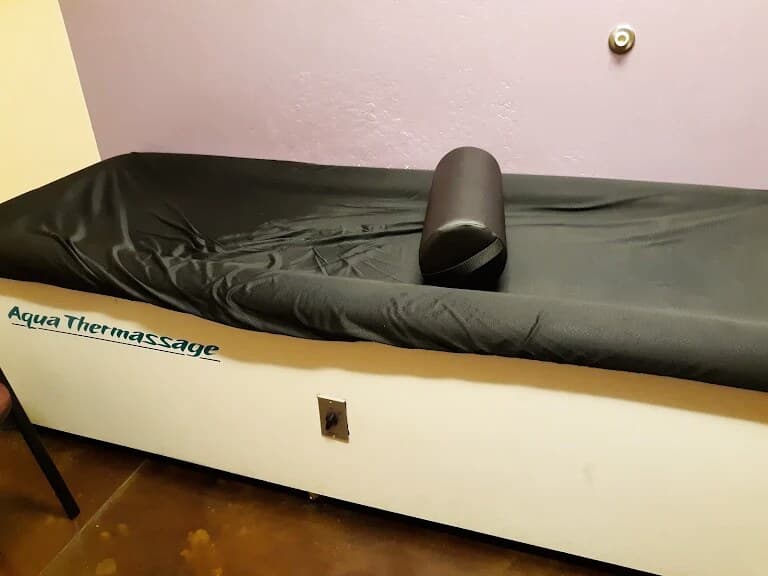 The Aqua Thermassage hydromassage table in a treatment room at LifeCare Chiropractic.
