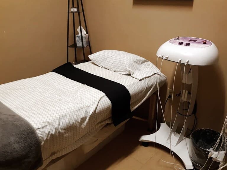 A LifeCare Chiropractic treatment room in Mesa, with its laser unit and leads beside the table.